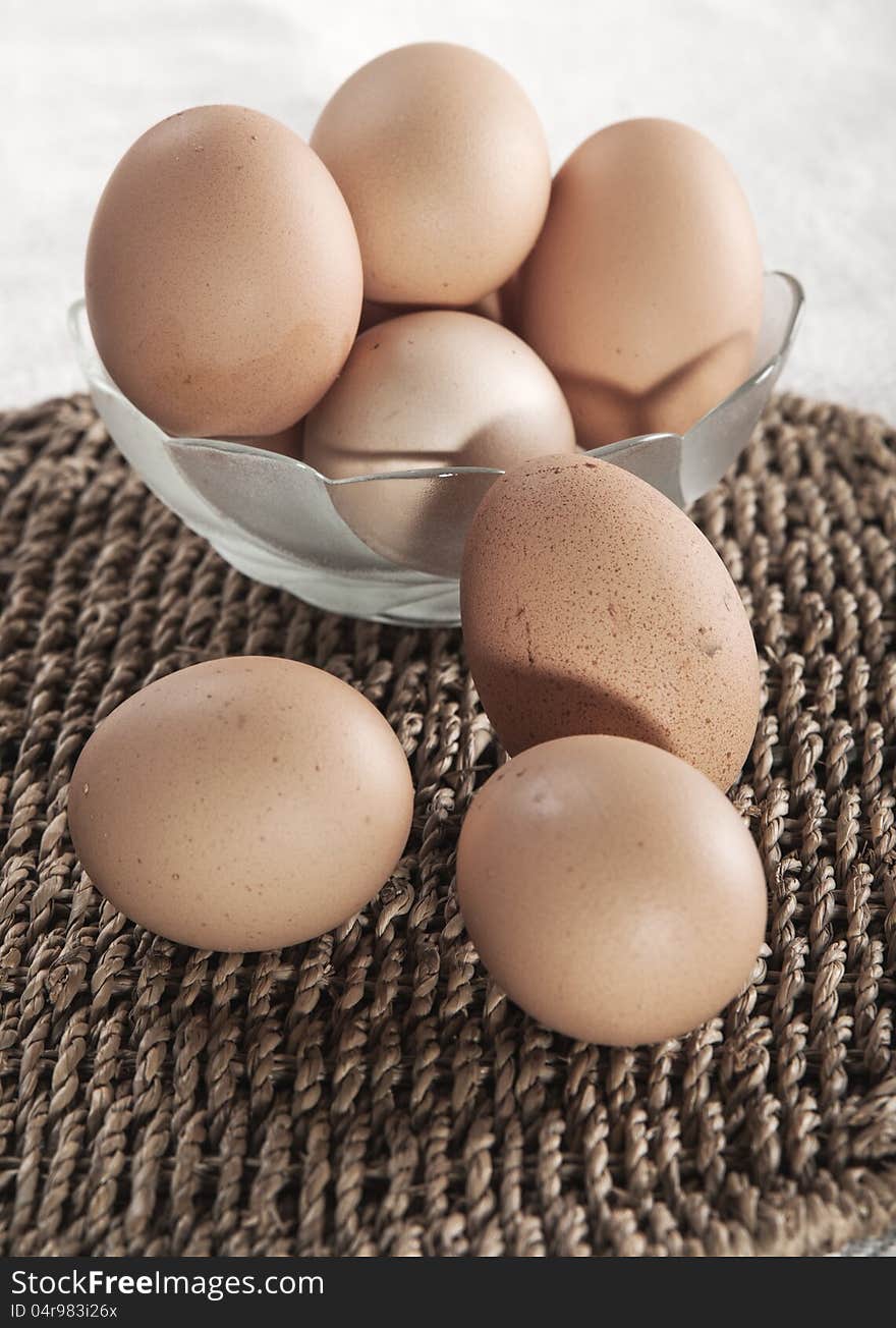 Eggs in glass bowl  on the table