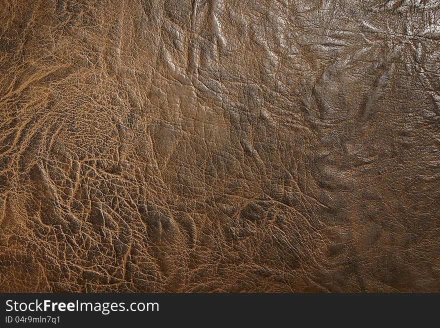 Brown leatherette texture, close-up