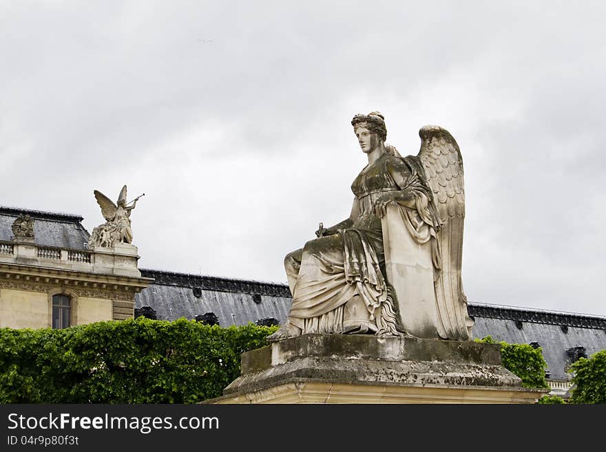 View of the beautiful statues located on the Avenue des Champs-Elysees in Paris, France