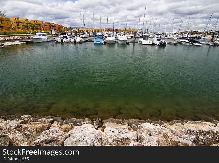 View of the beautiful marina filled with recreation boats, in Portimao, Portugal. View of the beautiful marina filled with recreation boats, in Portimao, Portugal.