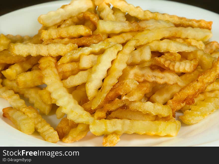 Baked french fries on the dish