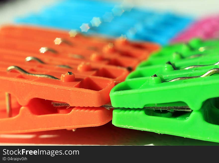 Colored plastic clothes pegs