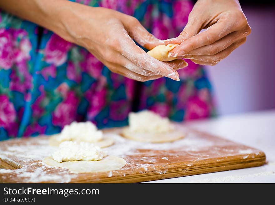 Closeup shot of girls' hands making patties. Closeup shot of girls' hands making patties