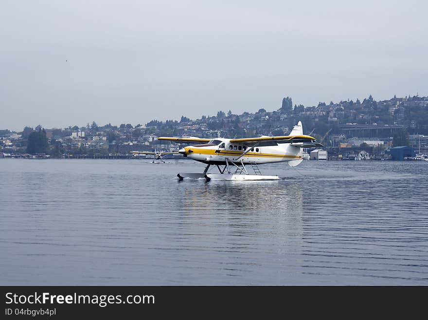 Floatplane landing on lake