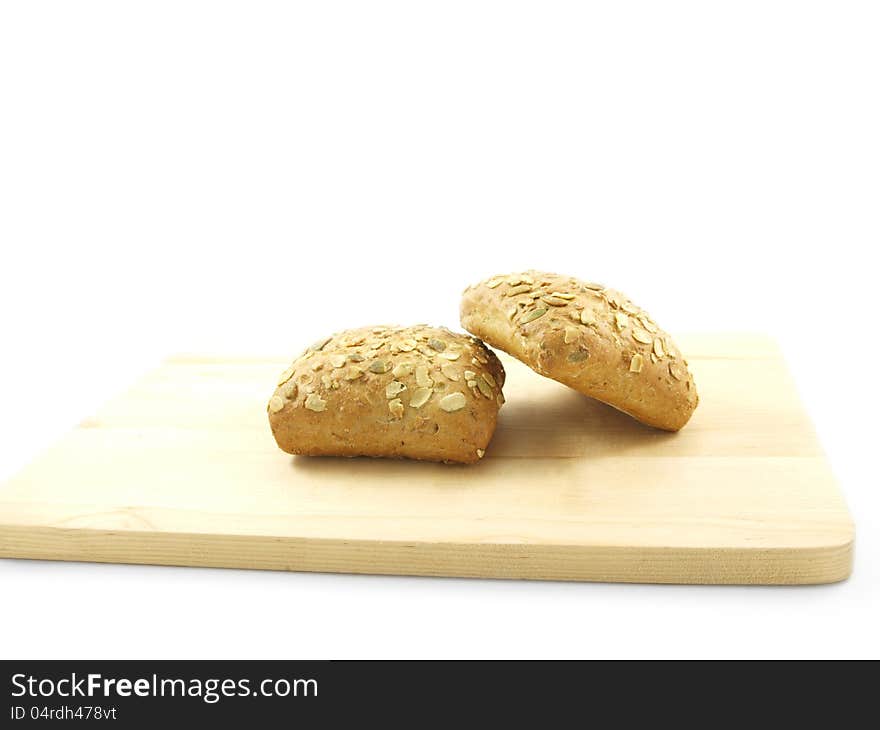 Bread with seeds on a wooden board