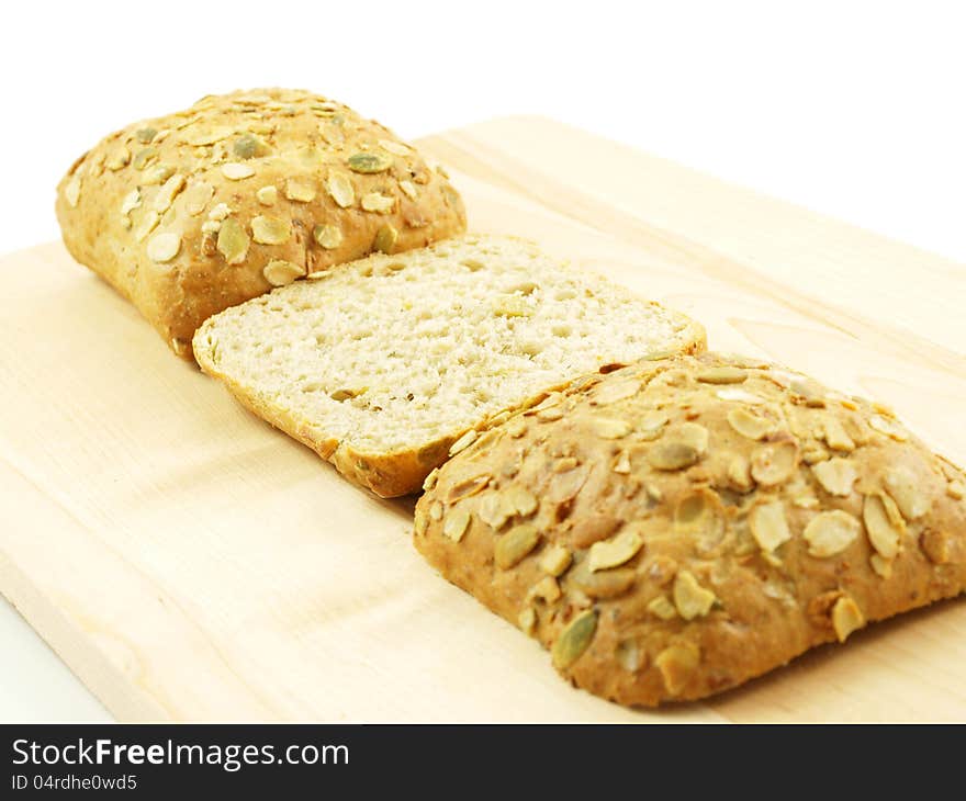 Bread with seeds on a wooden board