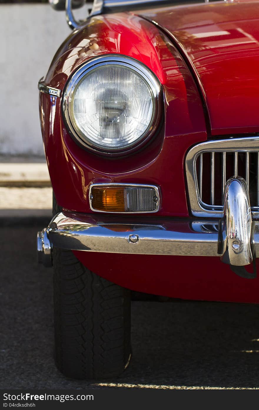 Detail view of a vintage car on display on a city. Detail view of a vintage car on display on a city.