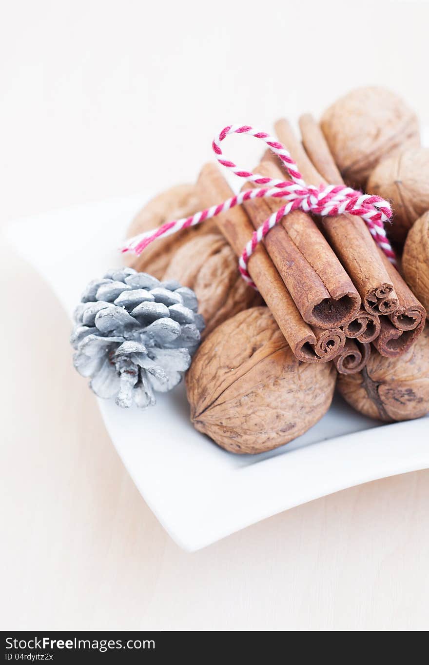 Christmas still life with  walnuts, ribbon and cinnamon sticks. Christmas still life with  walnuts, ribbon and cinnamon sticks