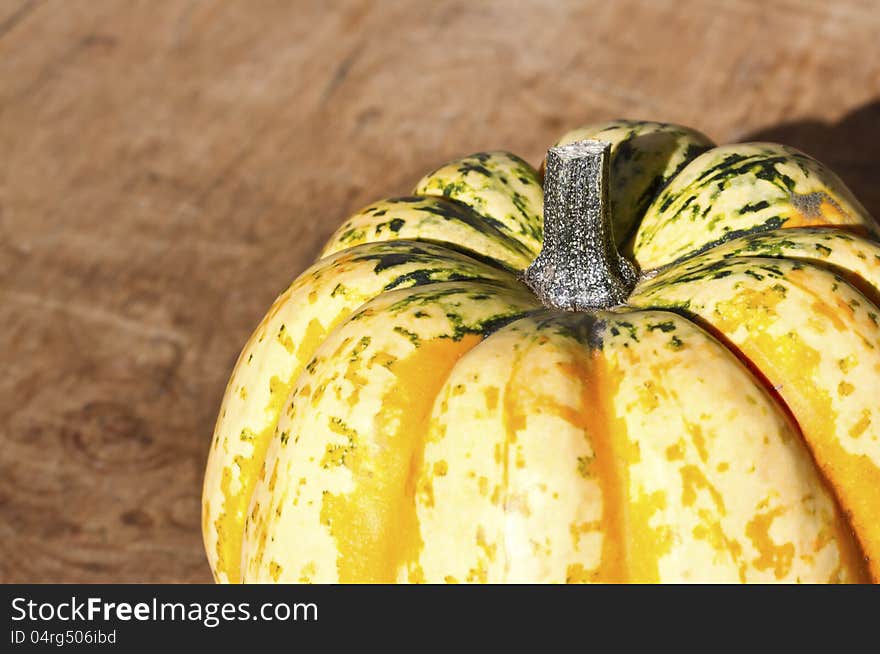 Background with pumpkin on wooden board