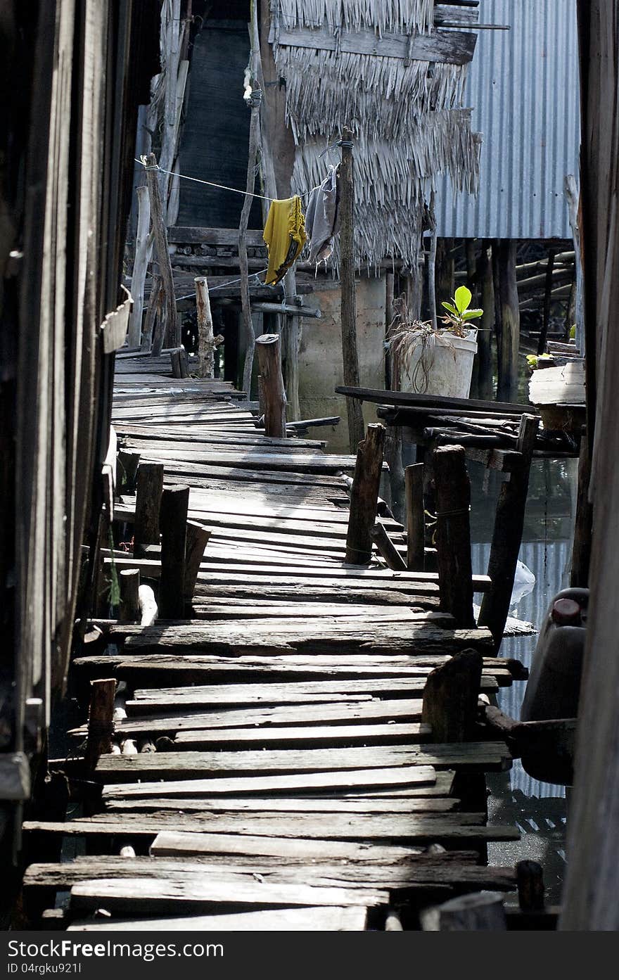 A walkway made by several wood planks. A walkway made by several wood planks