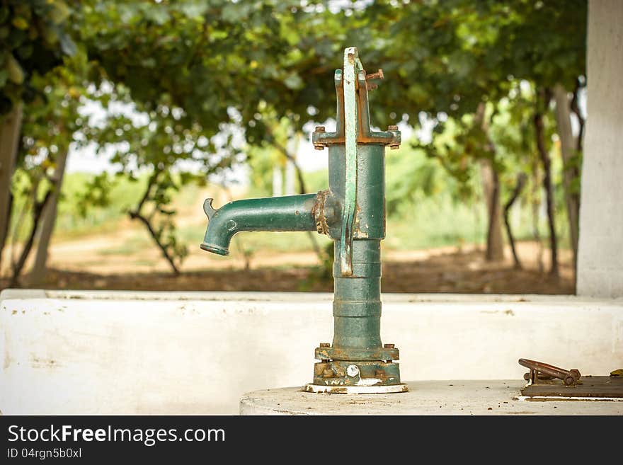 Old Hand water pump in the vineyard