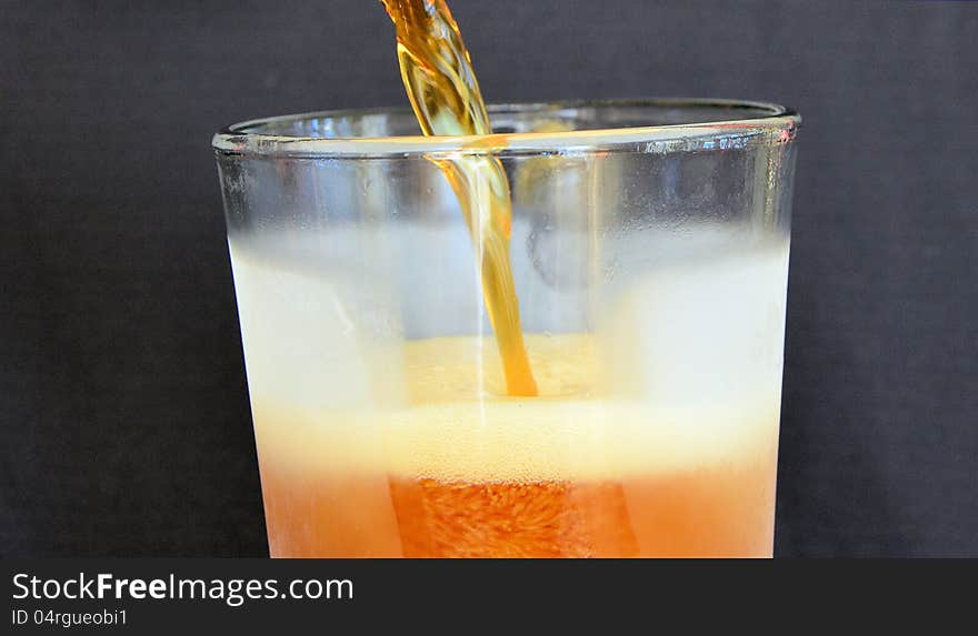 Beer pouring into a a cold glass. Beer pouring into a a cold glass