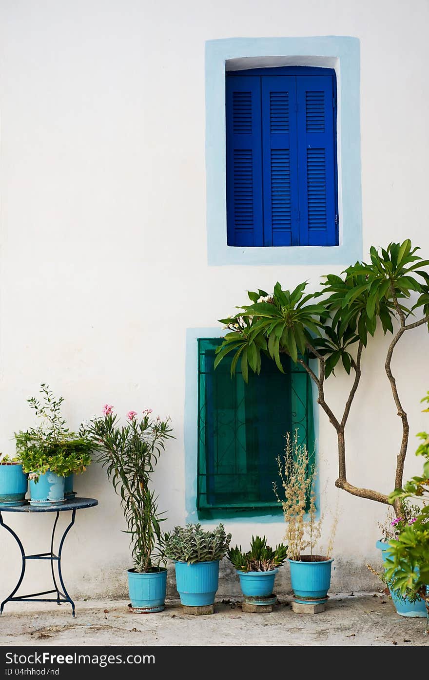 Wall with colored windows from a traditional Greek house in Poros island. Wall with colored windows from a traditional Greek house in Poros island