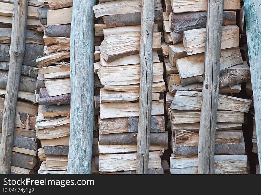 A pile of firewood for poles backed. A pile of firewood for poles backed.