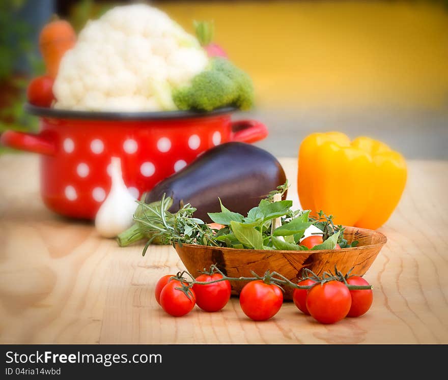 Fresh organic vegetables, herbs and spices on the table