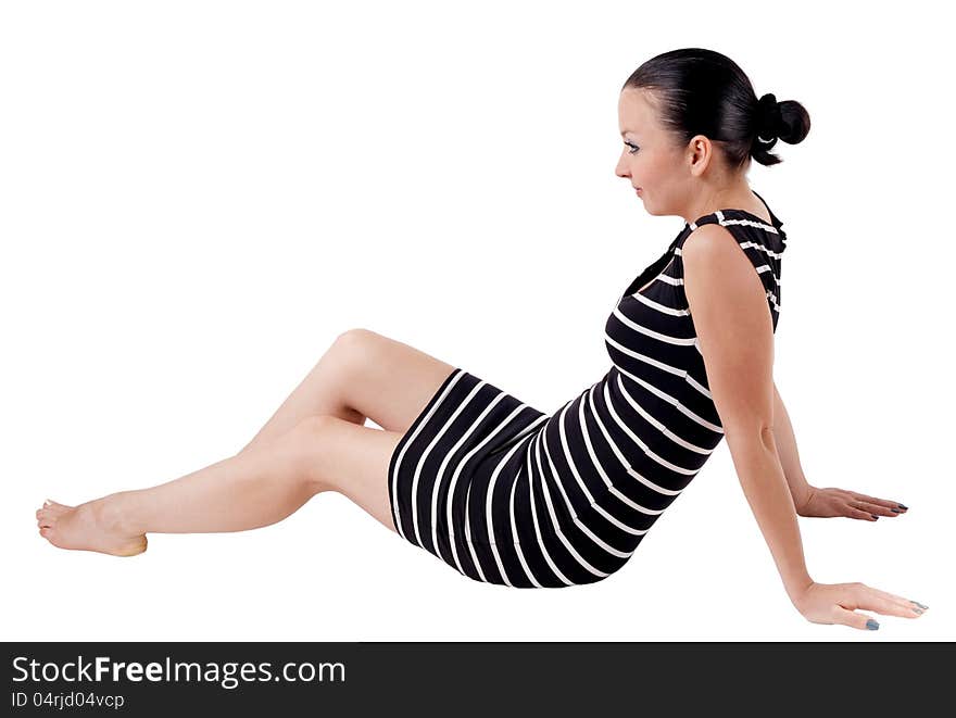 Portrait of a pretty girl posing sitting isolated white background