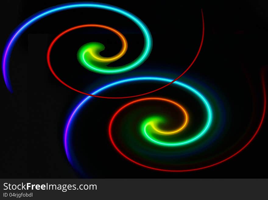 Twin twirls made of colorful laser from a disc.