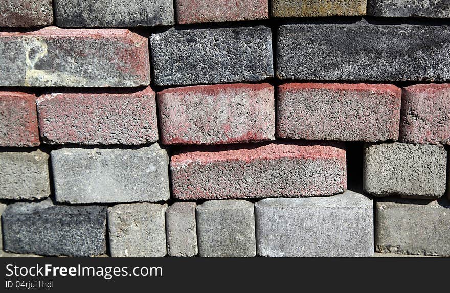 Background: a wall of gray bricks