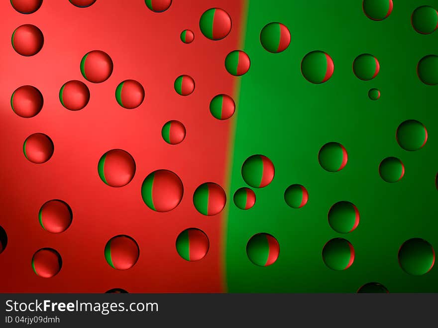 Water droplets on glass. Colorful background is reflected in the drops. macro. Water droplets on glass. Colorful background is reflected in the drops. macro