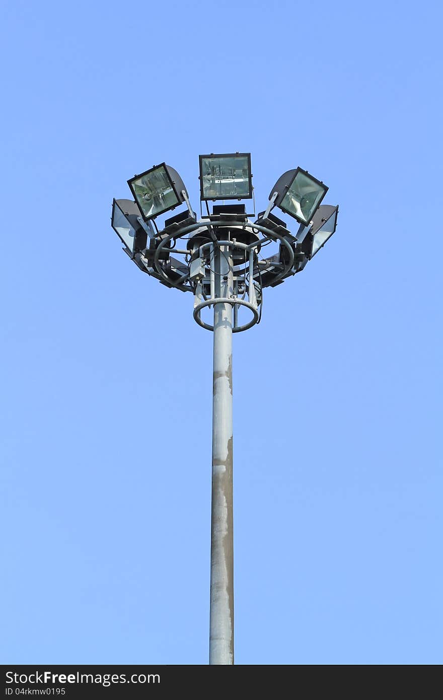 Spotlight tower for traffic on blue sky background