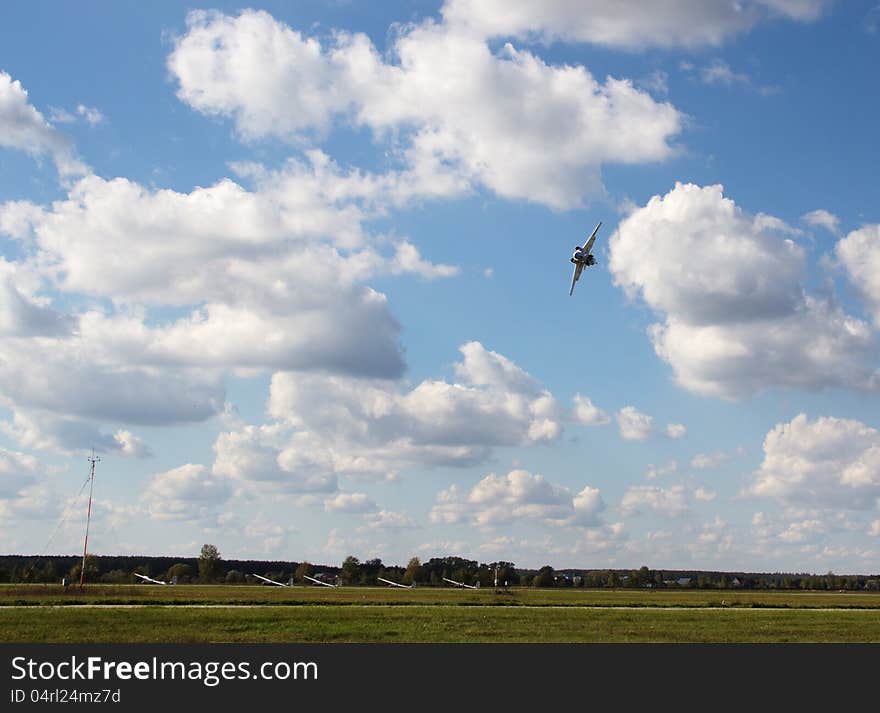 Aircraft airfield flying over  in blue sky background