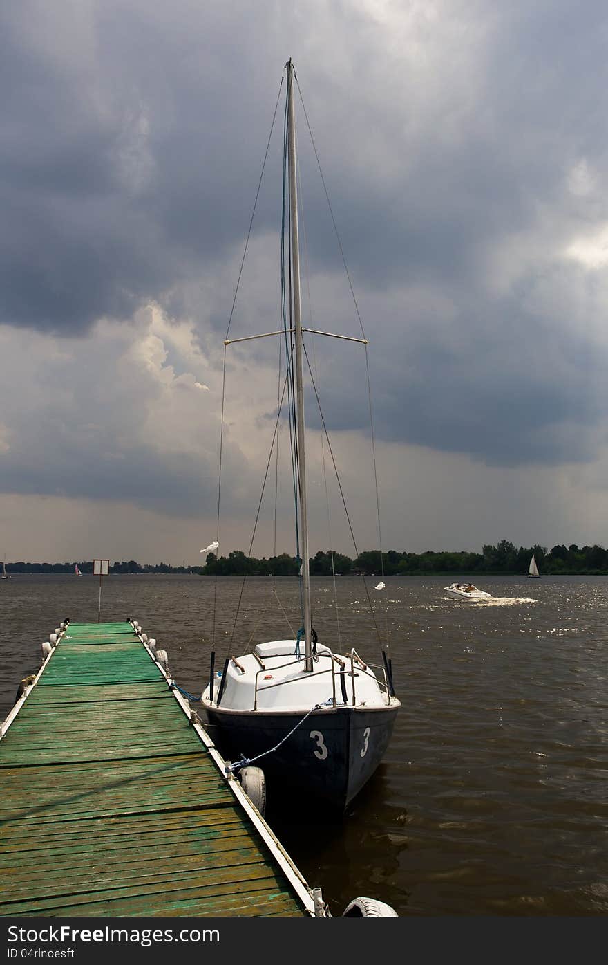 Yacht on platform on lake. Yacht on platform on lake