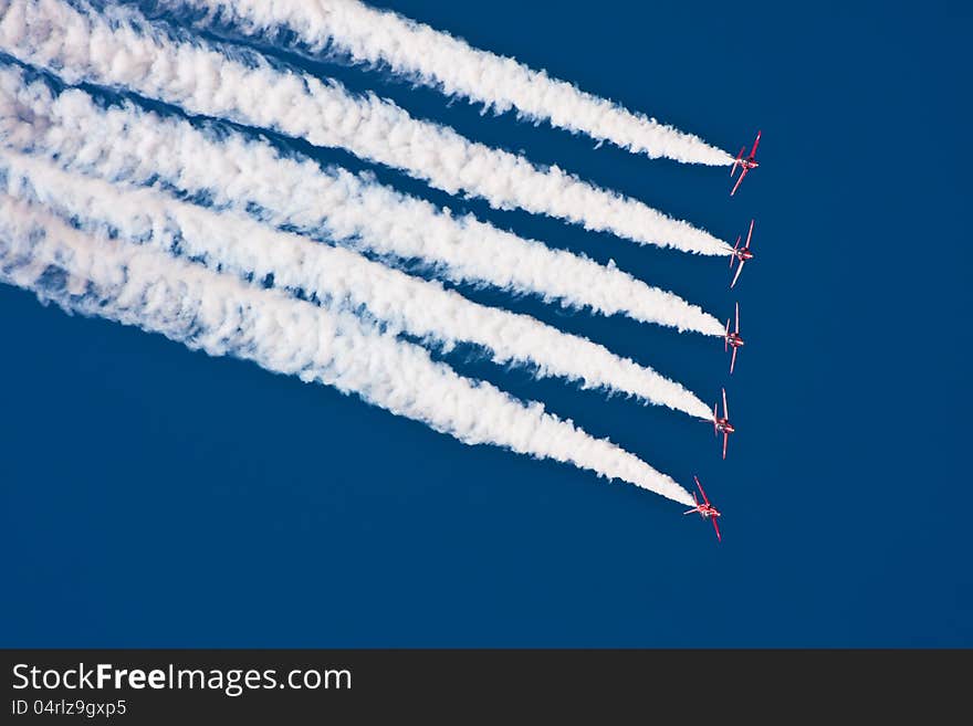 Air show performance with jet fighters - Red Arrows Royal Air Force Aerobatic Team. Air show performance with jet fighters - Red Arrows Royal Air Force Aerobatic Team