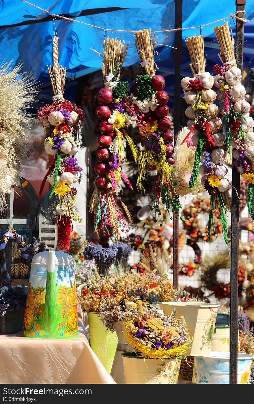 Big variation of onion and garlic, herbs, dried handmade flower bouquets, wreaths, spices, aromatic pillows. Big variation of onion and garlic, herbs, dried handmade flower bouquets, wreaths, spices, aromatic pillows