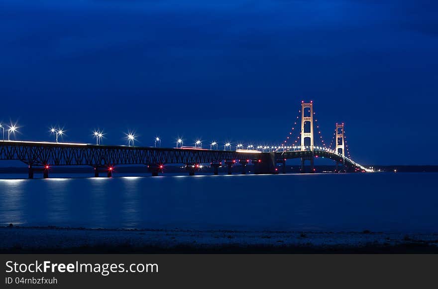 The Mackinac Bridge is located on Interstate 75 in northern Michigan at the Straits of Mackinac. The bridge connects Michigan's upper and lower peninsulas. The Mackinac Bridge is located on Interstate 75 in northern Michigan at the Straits of Mackinac. The bridge connects Michigan's upper and lower peninsulas.