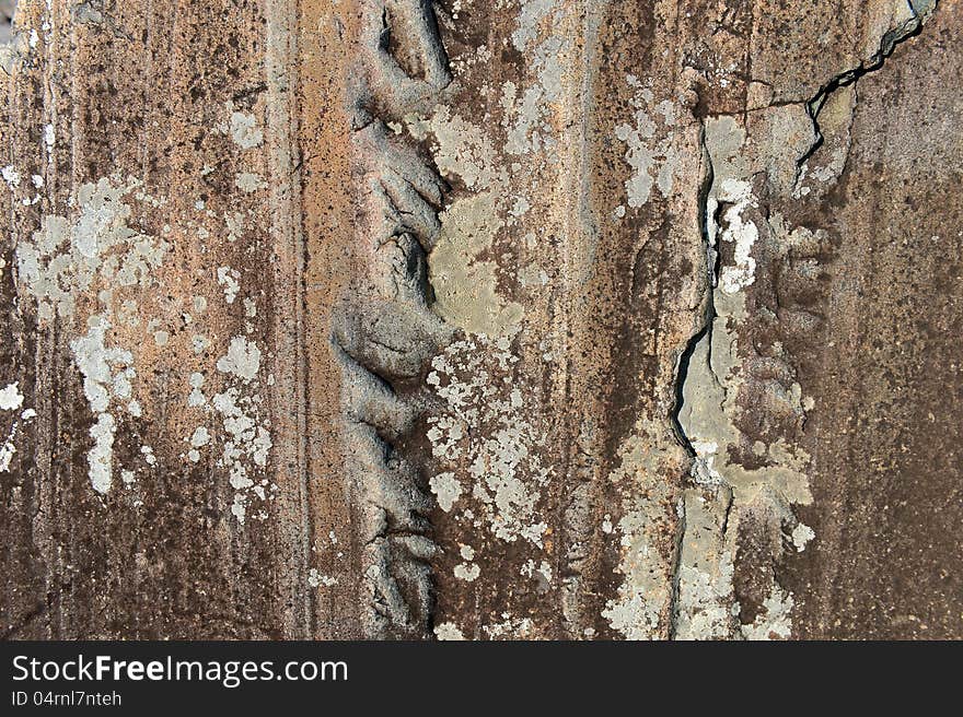 Background detail of old rock with cracks and patterns