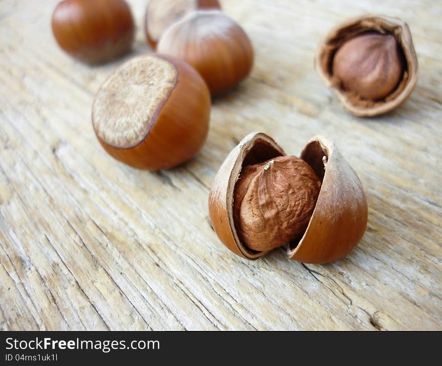 Hazelnuts on a wooden background