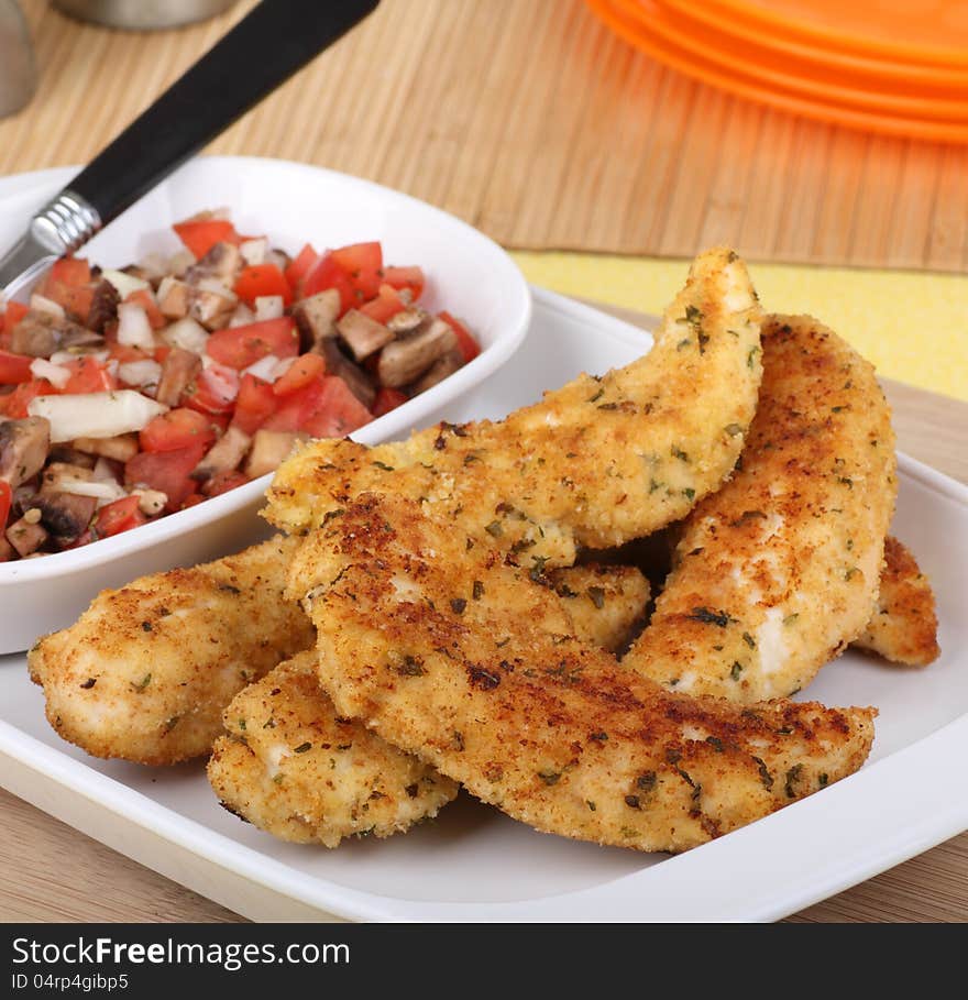 Meal of chicken tenderloin strips on a serving platter