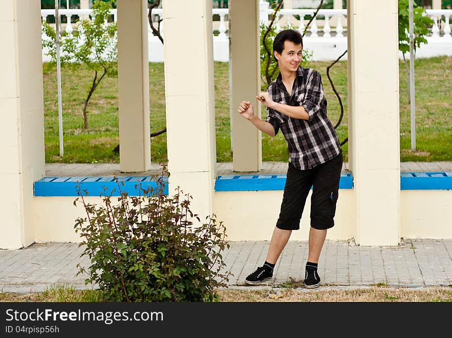 Boy stay near the pillar