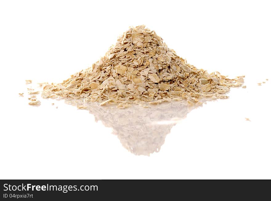 Pile of oatmeal over white background