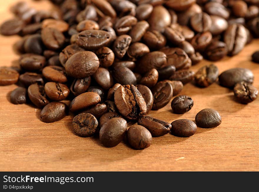 Coffee beans shot on the wooden background