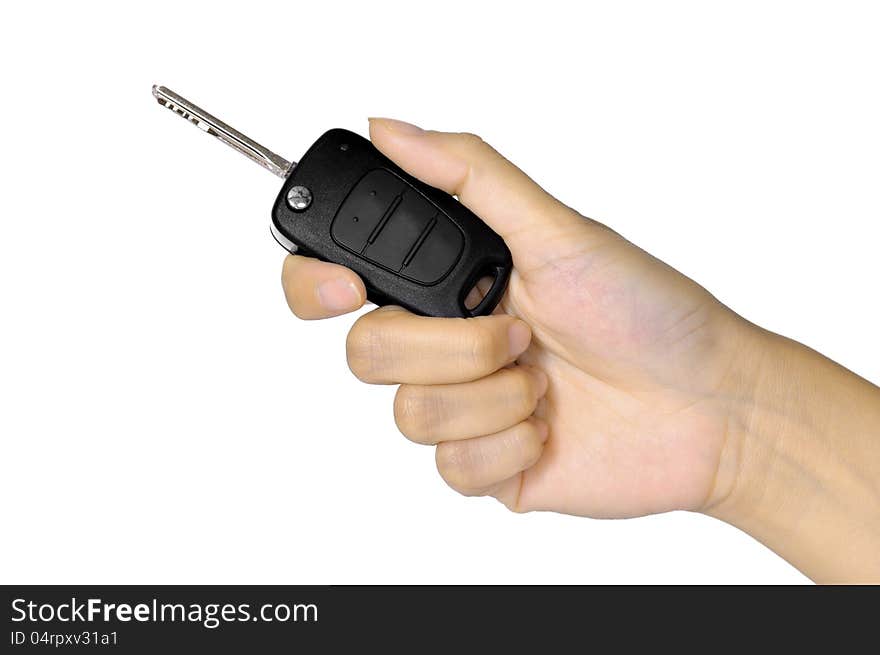 Hand with car key isolated over white background. Selling car concept