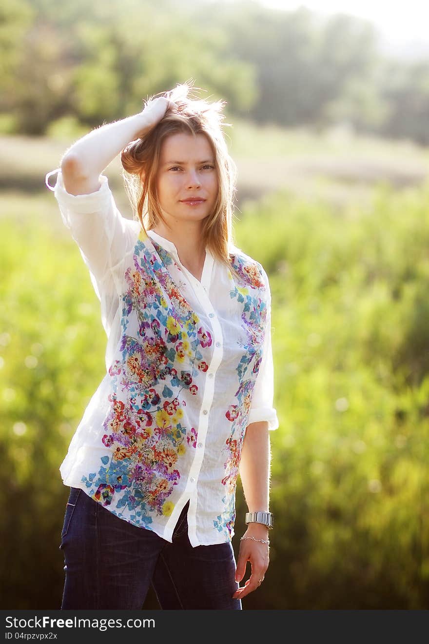 Portrait of beautiful blond woman outdoors