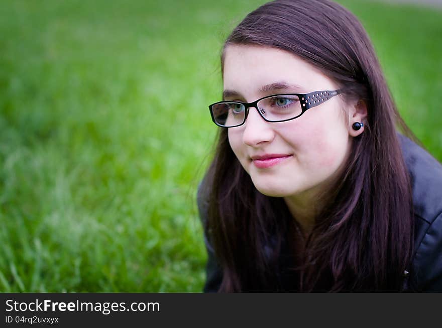 Girl teen outdoors closeup in a meadow