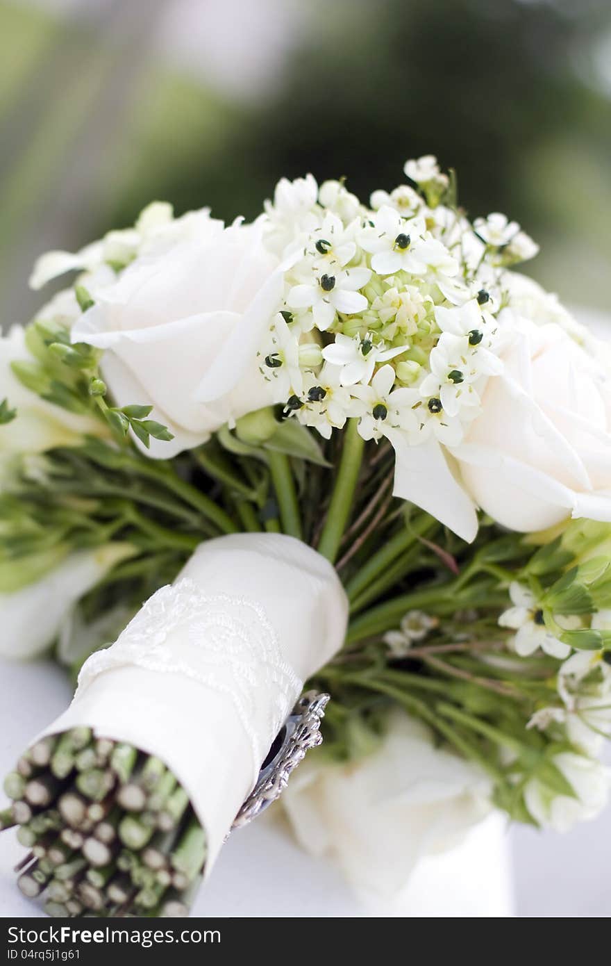 Beautiful white wedding bouquet with roses