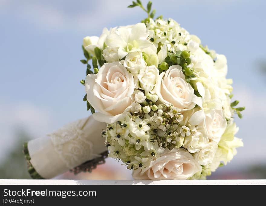 Beautiful white wedding bouquet with roses