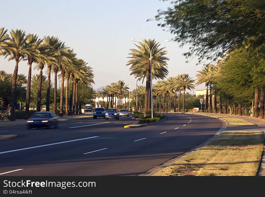 Curve of road on a southwest city street at sunset