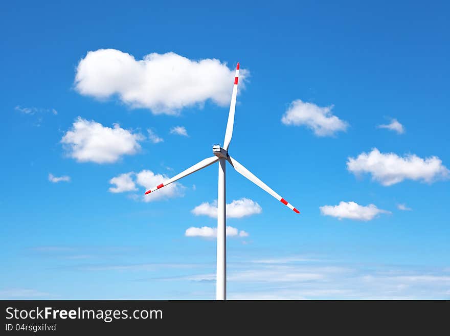 Windmill against the sky with clouds