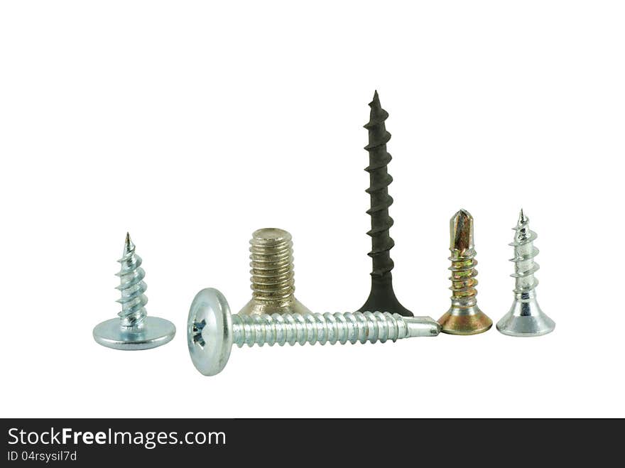 Group of different screws on a white background