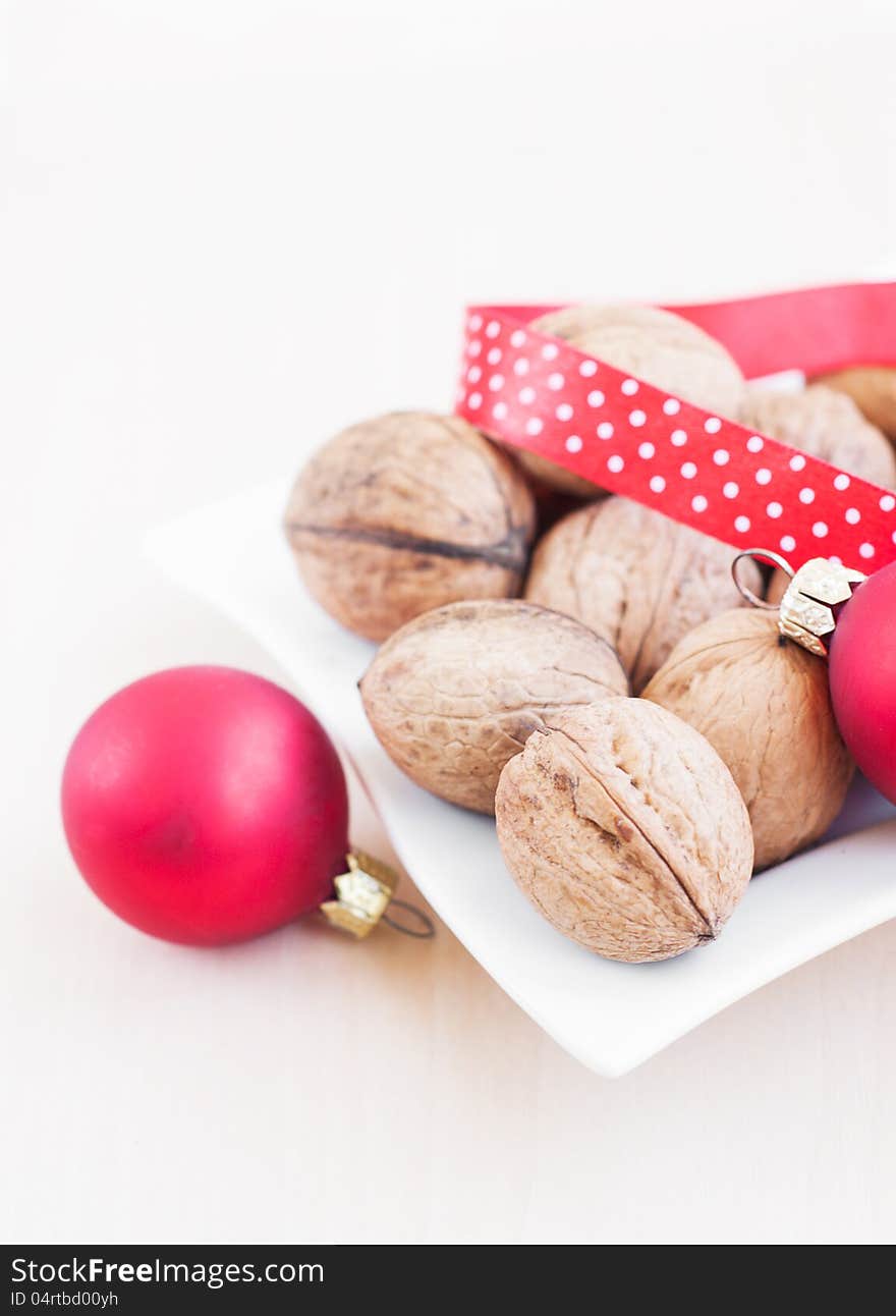 Christmas still life with  walnuts, ribbon and red balls. Christmas still life with  walnuts, ribbon and red balls.