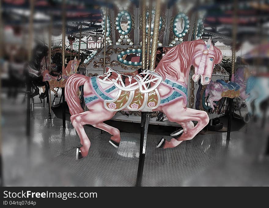 Pink carousel horse on merry go round at the fair