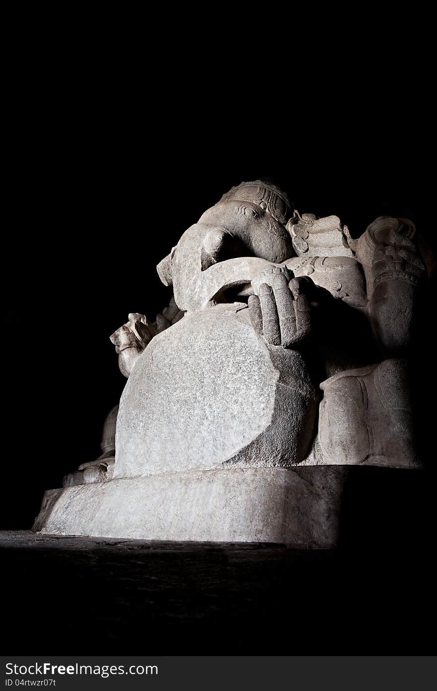 Indian god sculpture at Kadalekalu Ganesha Temple at the Sacred Center around Hampi, Karnataka, India