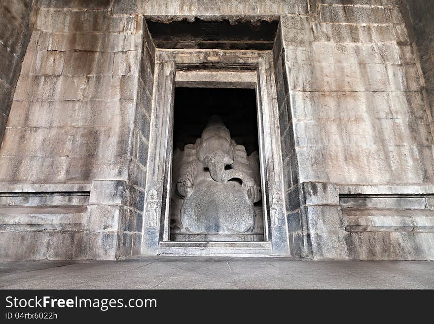 Indian god sculpture at Kadalekalu Ganesha Temple at the Sacred Center around Hampi, Karnataka, India