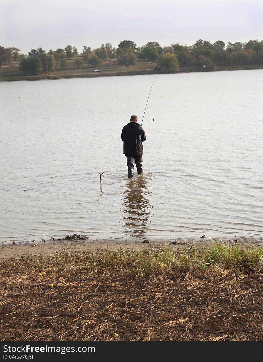 Fisherman Fishing in a lake