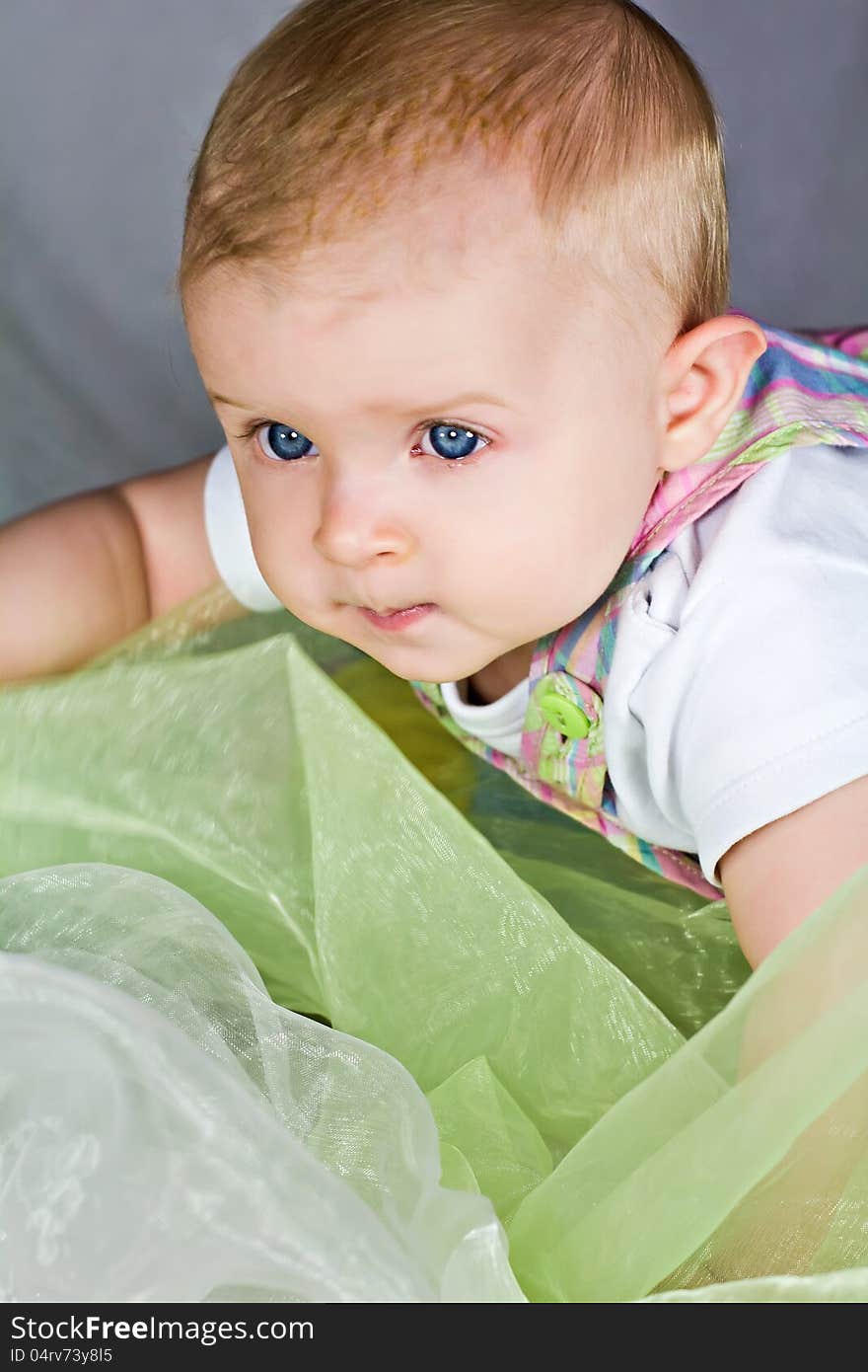 Earnest cute baby girl face. Earnest cute baby girl face