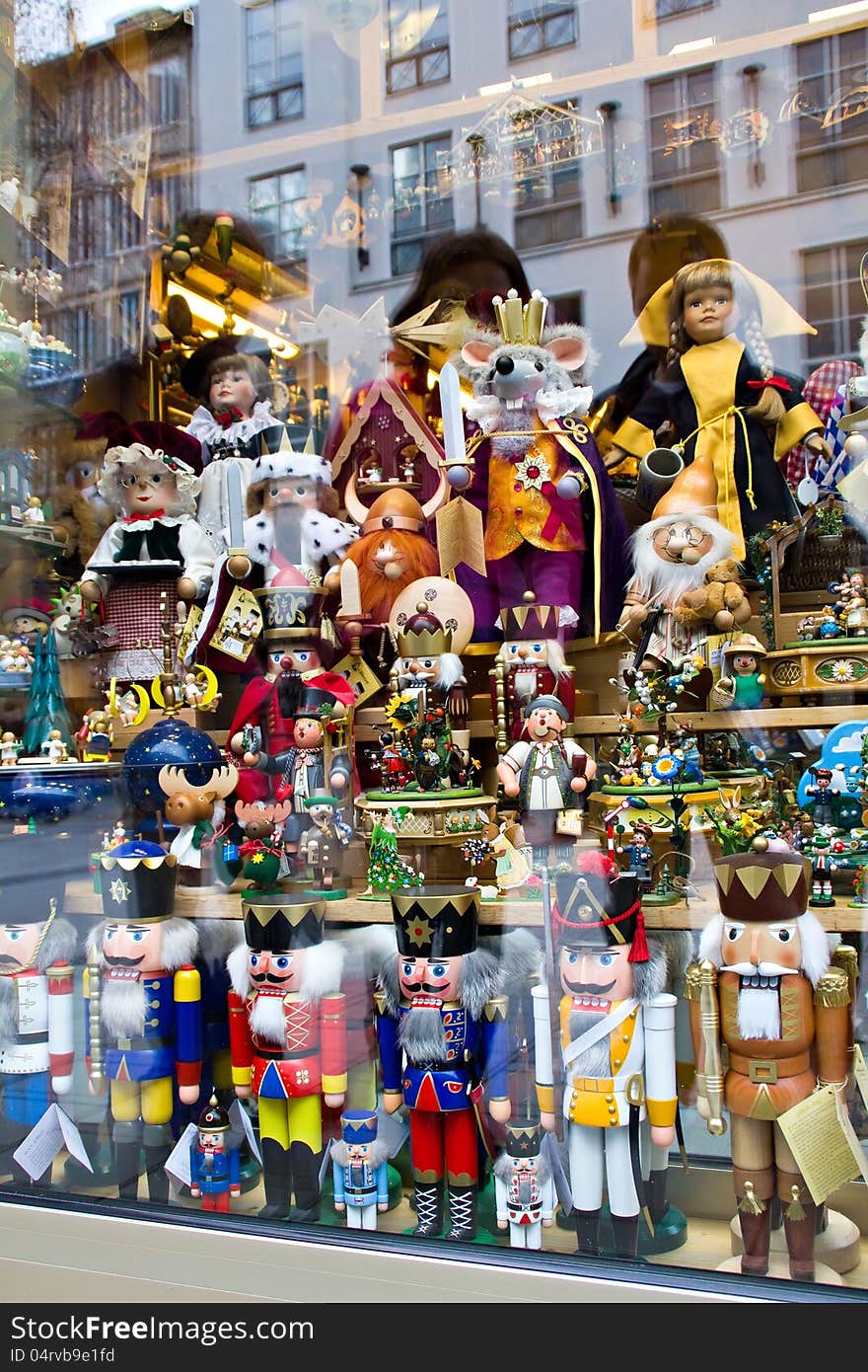 Nutcrackers and other wooden dolls in the shop window. Nutcrackers and other wooden dolls in the shop window